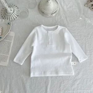 White ribbed baby long sleeve t-shirt with button neckline, ideal for daily autumn wear.