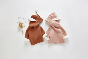 Cute baby knitted hoodie with adorable bunny ears detail, soft fleece lining for extra warmth.