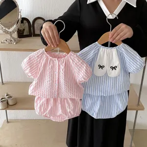 Detailed view of baby girl summer striped top and shorts set with cute bunny ear design.