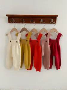 Cute baby knit overalls detail showing multiple colors, soft cotton infant rompers for autumn spring.