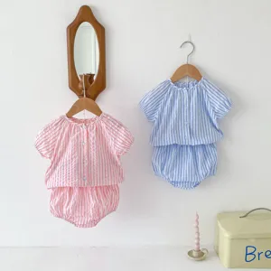 Infant striped two-piece set detail view, featuring short sleeve top and shorts in pink and blue.