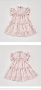 Baby girl summer dress featuring a sweet ruffled mock neck, cute flutter sleeves and layered skirt.
