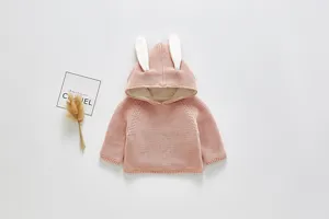 Detailed view of cute pink baby cardigan with plush rabbit ears, warm fleece lining closeup.