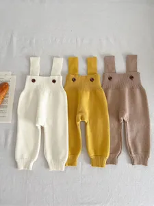 Infant knit suspender pants detail, cute baby autumn romper, soft toddler knitted trousers.