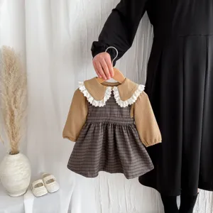 Infant baby girl autumn long-sleeve plaid dress set with white lace ruffle collar details.