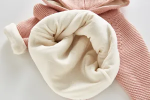 Detailed view of fluffy fleece lined baby knit cardigan inner texture and soft fabric quality