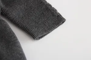 Dark grey knit baby dress sleeve detail, soft texture and warm fabric for infants.