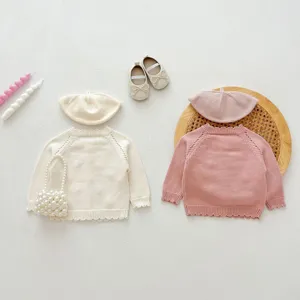 Baby girl cute knit cardigan sweater set with matching beret and bag details view.