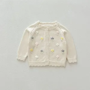 Cozy baby girl knit cardigan with delicate floral embroidery, raglan sleeves and cute scalloped edges.