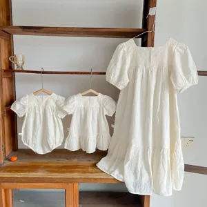 Korean style family matching embroidered dresses and cute baby rompers with bubble short sleeves.