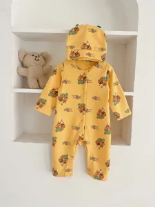 Detailed view of yellow waffle baby long-sleeve romper and matching hat with cute squirrel print.