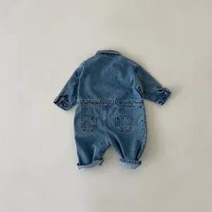 Back view detail of infant blue denim jumpsuit, classic wash, comfortable long sleeves.
