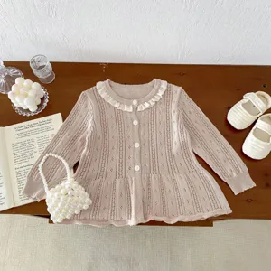 Detailed view of baby knitted cardigan, hollow-out thin cotton gauze, cute ruffle collar style.