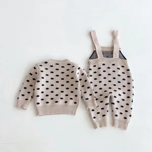 Baby knitted sweater and suspenders set, cute polka dot design, soft cotton apparel.