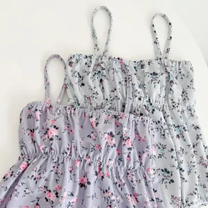 Detail shot of cute baby girls floral spaghetti strap swimwear, sweet summer toddler swimsuit.