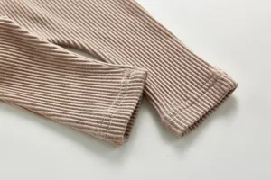 Infant baby ribbed cotton pants detail shot, soft breathable high waist trousers for autumn daily wear.