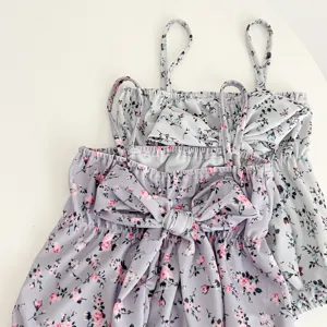 Cute baby girl floral swimsuit with bow straps, stylish summer toddler swimwear for vacation.