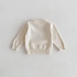 Detailed view of the baby knitted sweater back, showcasing soft cotton yarn and neat ribbed trim.