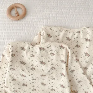 Baby floral print cotton long sleeve top detail showing cute vintage floral pattern and fabric.