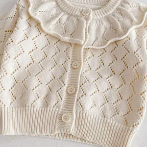 Baby girl knit cardigan detail, hollow out pattern, large lotus leaf collar, soft yarn material.