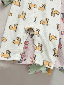 Infant waffle baby romper close up, cute animal print infant jumpsuit, soft cotton crawling clothes.