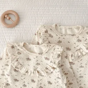 Cute baby girl floral long sleeve top detail showing exquisite ruffled collar and soft cotton fabric.