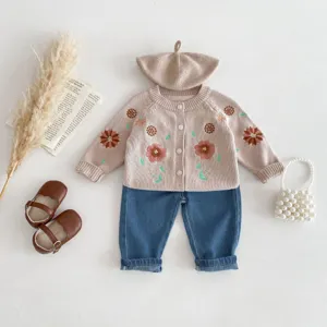 Baby girls floral embroidered knit cardigan set with stylish denim pants and matching hat details.