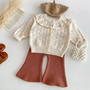 Infant baby girl knit cardigan and flared pants set with large ruffle collar detail.