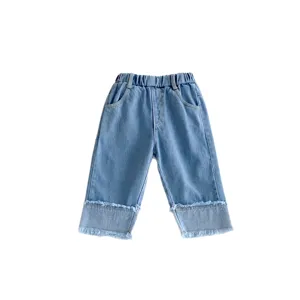 Cute girls light blue washed denim jeans with elastic waist and stylish frayed wide legs main view