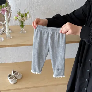 Infant baby girl grey ribbed leggings with lace trim and cute bow embroidery detail.