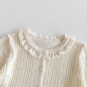 Infant knit cardigan detail shot, breathable hollow knit pattern with cute ruffled collar.