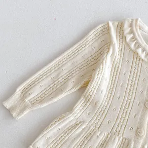 Baby girl knitted cardigan detail view, hollow breathable cotton yarn, delicate ruffle collar.