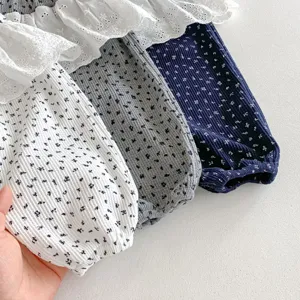 Baby girl floral ruffle leggings detail shot showcasing cute toddler pants with lace trim.