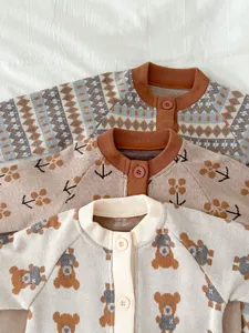 Detail view of cute baby knit cardigans, soft fabric and cozy styles for newborn infants.