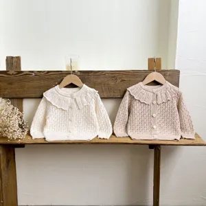 Infant baby knitted cardigan with sweet ruffle collar, long sleeve button-up sweater detail view.
