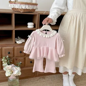 Chic toddler pink two-piece set with mesh doll collar top and stylish flared trousers details.