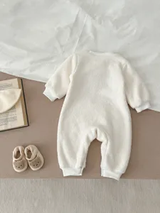 White fleece baby romper detail view, soft sherpa material, cozy winter long sleeve crawlers.