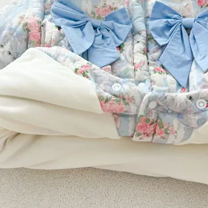 Cute baby winter fleece romper detail, floral print with sweet blue bows and soft lining.