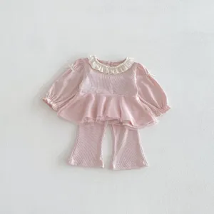 Cute toddler girls pink two-piece outfit detail showing lace collar and mesh peplum pants.