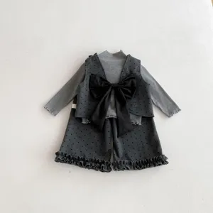 Chic toddler girls spring three-piece set with stylish polka dot vest and matching pants.