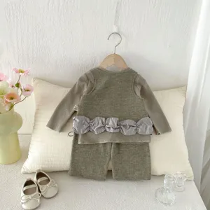 Cute toddler girl waffle knit 3-piece long sleeve top vest pants set detail view.