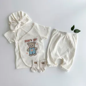 Infant summer cotton short sleeve top pants hat socks set detail view, cute cartoon bear print.