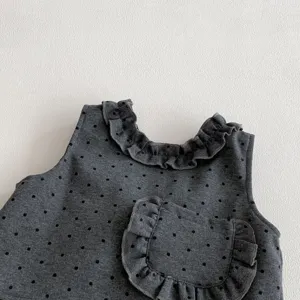 Toddler girl spring polka dot top detail, cute ruffled collar and pocket, soft knit fabric.