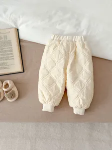 Cozy baby quilted winter cotton pants in soft cream, thick fleece lined for cold days.