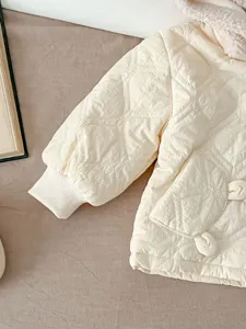 Infant quilted winter jacket with bear pocket and plush hood, warm toddler cotton coat.