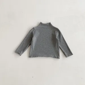 Detailed view of grey ribbed long sleeve top for girls, comfortable daily wear basic shirt.
