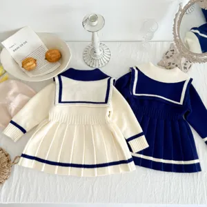 Details of the toddler girls sailor collar knit pleated sweater dress in navy and white.