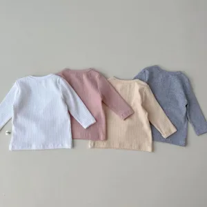 Infant ribbed long sleeve T-shirt detail showing neat stitching and soft cotton fabric.