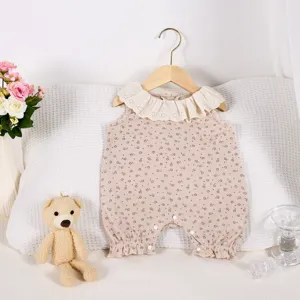 Cute baby girl sleeveless floral romper with delicate lace ruffle collar for summer wear.
