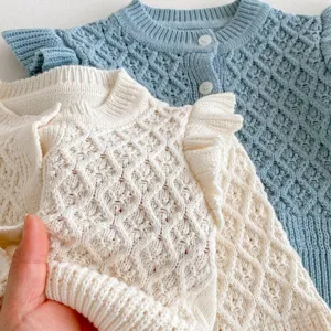 Baby girls knit cardigan sweater with diamond pattern and fly sleeves. Soft cotton yarn details.
